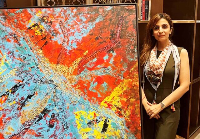 Artist Anita Goel with her work