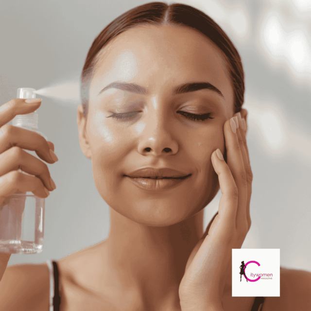 A woman sprays rose water on her face