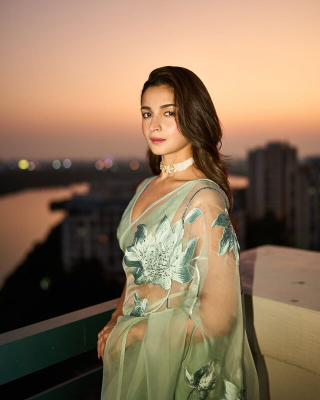 Alia Bhatt wearing mint green organza saree with floral embroidery during golden hour photoshoot Alia Bhatt wearing mint green organza saree with floral embroidery during golden hour photoshoot