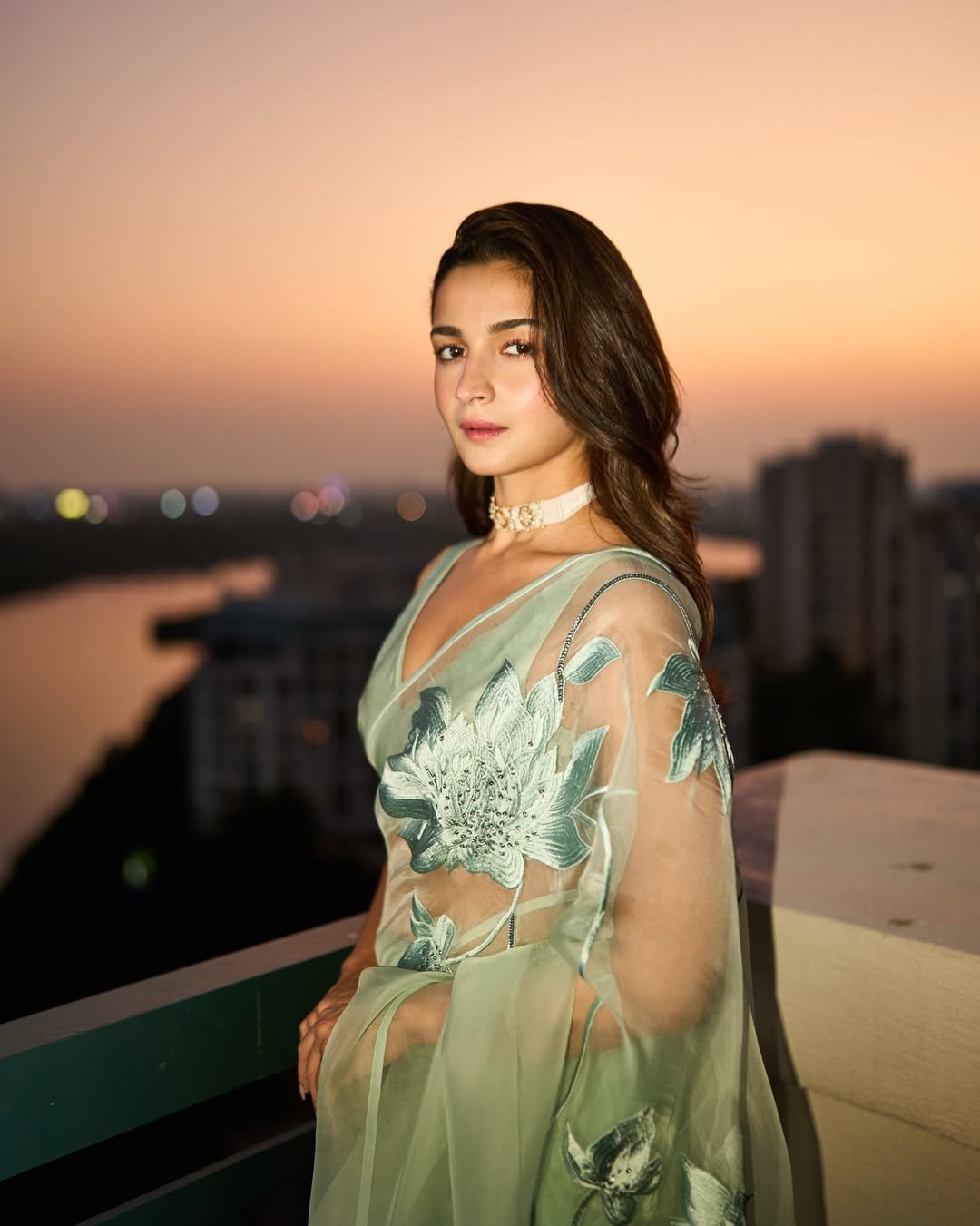 Alia Bhatt wearing mint green organza saree with floral embroidery during golden hour photoshoot