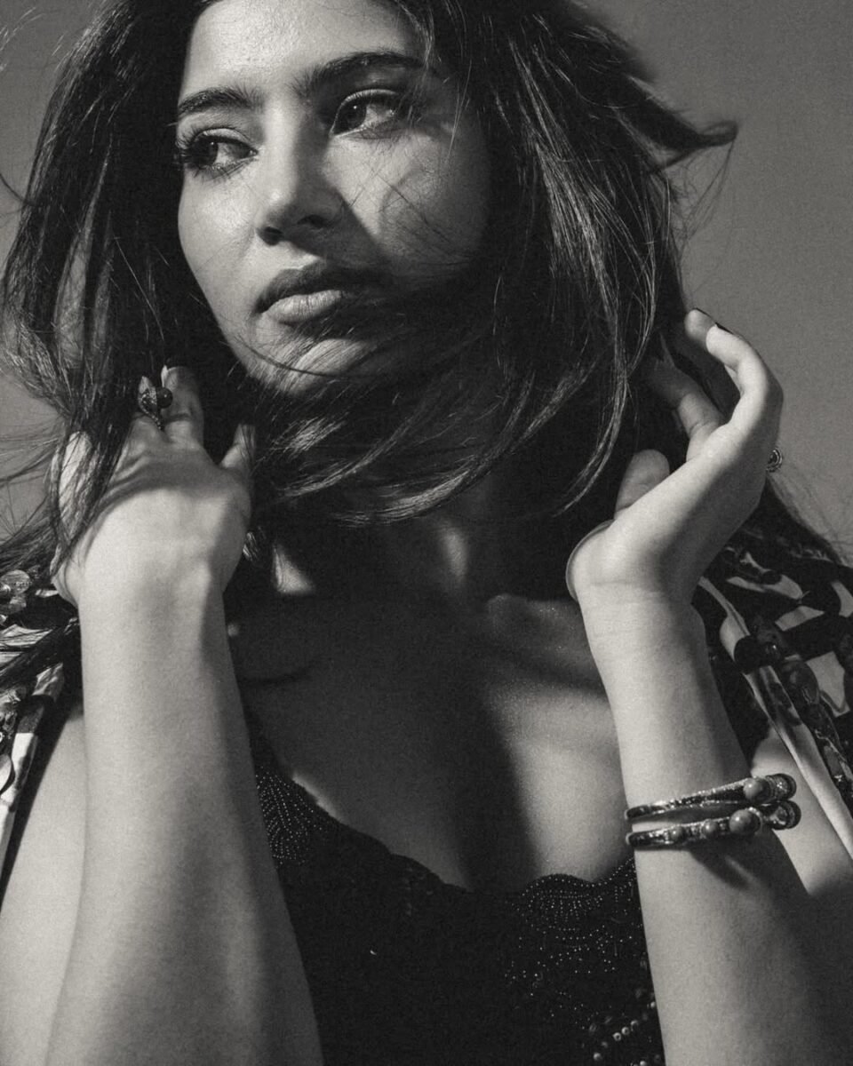 Sara Arjun posing in a printed Anamika Khanna AKOK