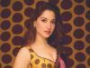 तमन्ना भाटिया की ‘पोल्का डॉट’ साड़ी Tamannaah Bhatia posing in a fluid chiffon sari by Karan Torani featuring a mix of large black and small yellow polka dots, styled with fine jewelry
