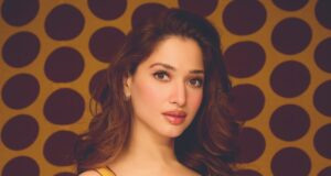 तमन्ना भाटिया की ‘पोल्का डॉट’ साड़ी Tamannaah Bhatia posing in a fluid chiffon sari by Karan Torani featuring a mix of large black and small yellow polka dots, styled with fine jewelry