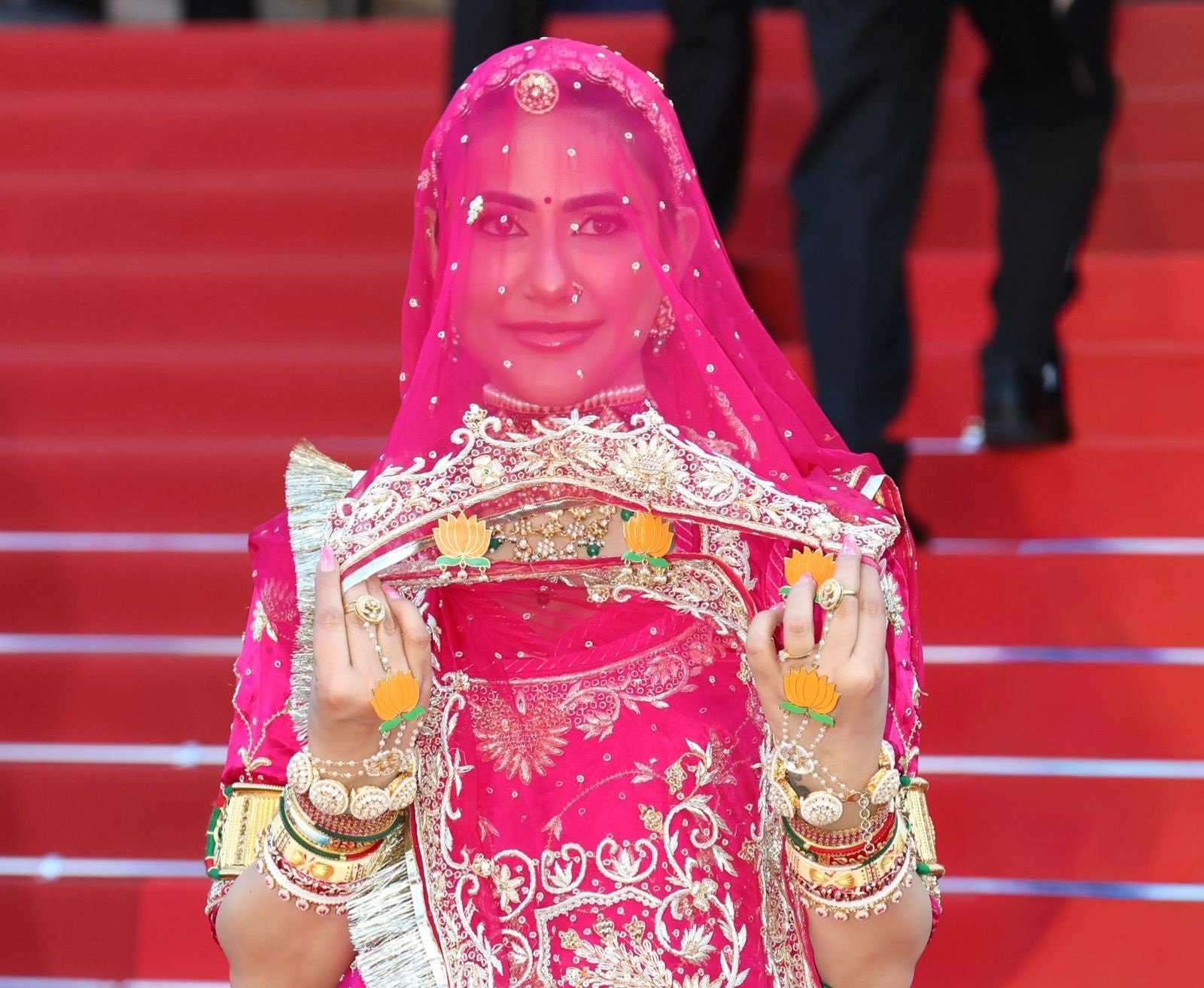Ruchi Gujjar in pink Rajasthani ghunghat-inspired outfit at Cannes Film Festival protesting forced ghughat practices and supporting women empowerment.